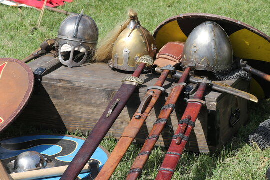 Medieval Swords Helmets and Shields Displayed on Wooden Chest Reenactment