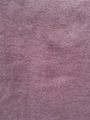 Dark mauve fabric texture featuring fine woven cotton threads with a soft knit pattern for textile background design © Jus