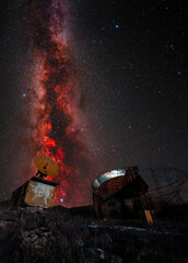 Old astronomical observatory against the bright colorful milky way galaxy. Night landscape. © Inga Av