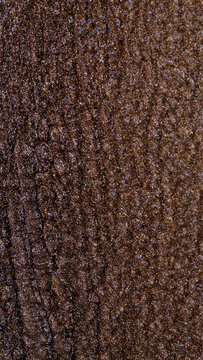 Mixing alcohol ink creating unique textures in warm brown shades