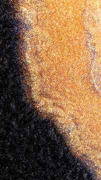 Mixing alcohol ink in a macro shot showing colorful textures and patterns