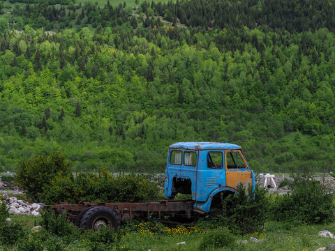 Abandoned Rusty Truck Wreck in Green Mountain Forest, copy space