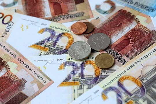 Belarusian ruble money banknotes and coins on table. Belarus cash bills of BYN currency