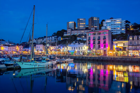 Torquay, Devon, United Kingdom. 08.26.2026 Torquay Marina shines bright across the English Riviera during dusk. 26th August 2026.