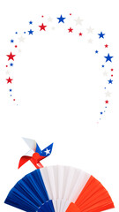 Obraz premium Pinwheel and paper fan in american flag colors with a falling star frame