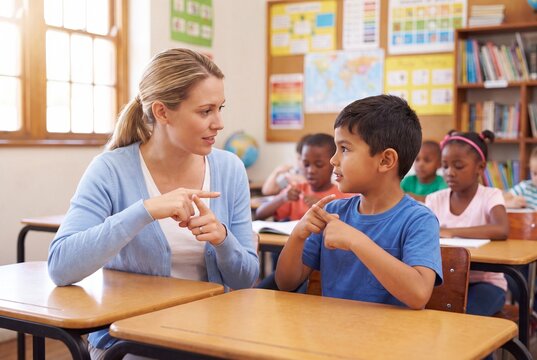 Teacher and Student Communicating Using Sign Language in Classroom