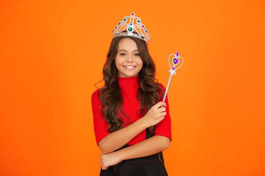 Party princess. Happy birthday. Birthday girl isolated on orange. Teen girl in crown at birthday party. Party celebration. Girlish princess crown. Happy teen girl in princess crown