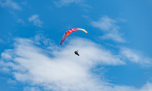 Paragliding sport activity. Parachute in the sky. Extreme rest and paragliding. Summer vacation. Extreme sport. Parachute paraglide. Sport and activity lifestyle. Paraglider paragliding recreation