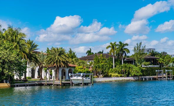 Waterfront landscape with house. Vacation building in summer. Luxury waterfront house. Hotel building. Residential architecture. Modern building Miami beach. Residential apartment in waterfront city