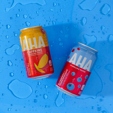 Cans of AHA Sparkling Water on blue background studio shot on August 29, 2021 in Yucca Valley, California