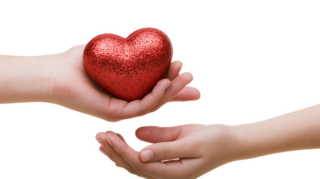 Isolated human hands giving and receiving a sparkling red heart showing love and care