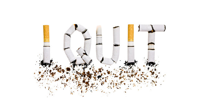 Isolated word I QUIT made from broken cigarettes with scattered tobacco, symbolizing smoking cessation