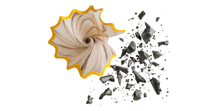 Isolated yellow pencil shaving with scattered graphite fragments symbolizing creativity and art.
