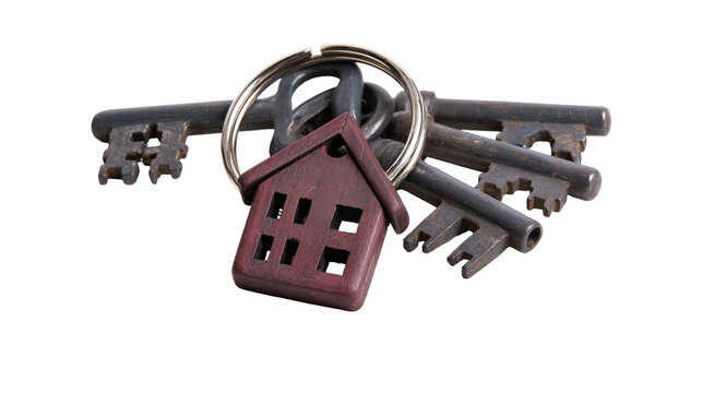 Isolated old rusty house keys with a wooden home shaped charm keyring symbolizing property.