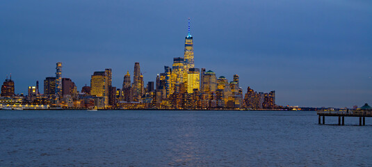 Naklejka premium New York City night skyline. New York City urban scene. New York City night skyline. New York City skyscrapers.