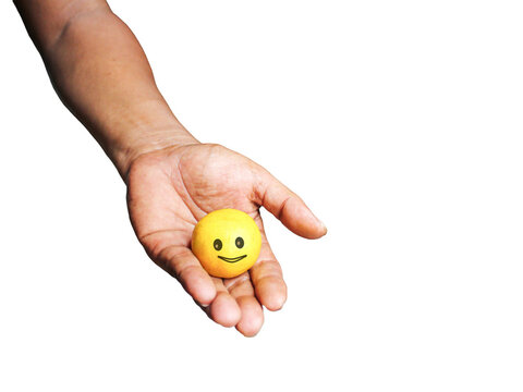 Hand holding yellow cute emoticon 