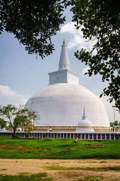 Ruwanwelisaya Stupa framed by tropical trees, Anuradhapura, Sri Lanka