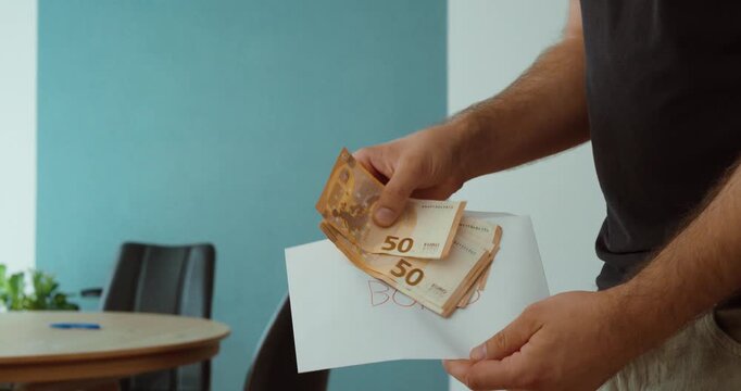 Person receiving euro banknotes as a bonus payment, representing employee reward, extra income, financial compensation and workplace incentive.