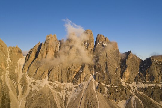 Aerial view, sunset at the Furchetta mountain with clouds, Geisler Alm, Sankt Magdalena, South Tyrol, Italy
