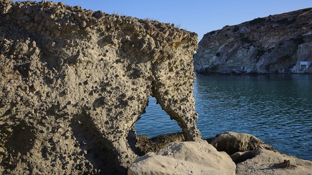Elephant shaped rocks, natural rock structure on a coast, view of calm blue water, Syrmata, boat garages, boathouse, boathouses, beach house, Goupa, Goypa, Goupa Kara, Kimolos, Cyclades, Greek Islands, Greece