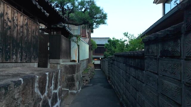 Narrow Alley Through Traditional Hillside Neighborhood in Onomichi, Japan