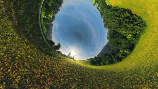 Creative drone footage of the M&uuml;hlviertel in Upper Austria transitioning from a natural aerial view into an inverted planet effect before smoothly returning to the normal landscape perspective.