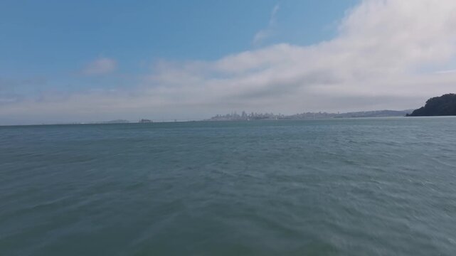 Intro drone shot with a reveal of San Francisco as seen from Sausalito, California