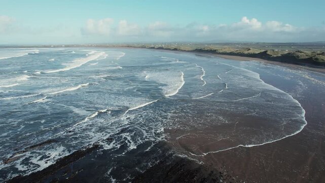 Drone Shot of Doughmore Beach on Low Tide, Ocean Waves on Sandy Shore in County Claire, Ireland