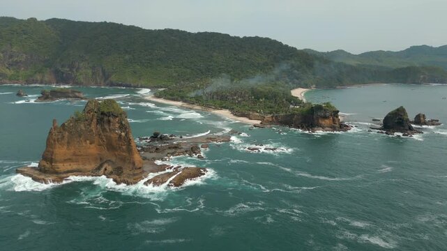 Tropical Pantai Papuma Peninsula Jember Indonesia Dramatic Scenes Drone Pull Back 4K 60FPS