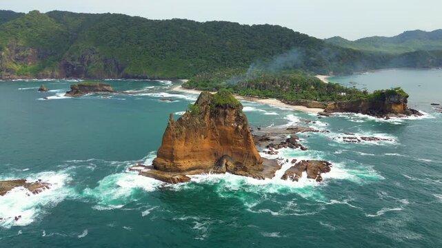 Pantai Papuma Jember Dramatic Cliffs And Rough Ocean South Java Indonesia Drone Track Right 4K 60FPS