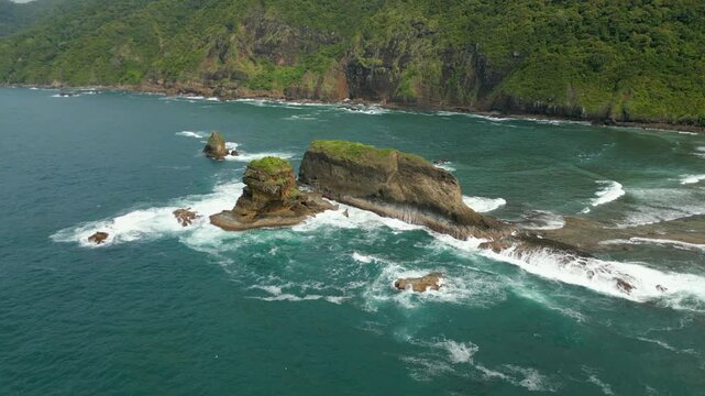 Dramatic Wave Erosion Rocky Pantai Papuma Jember East Java Indonesia Drone Slow Rotate 4K 60FPS