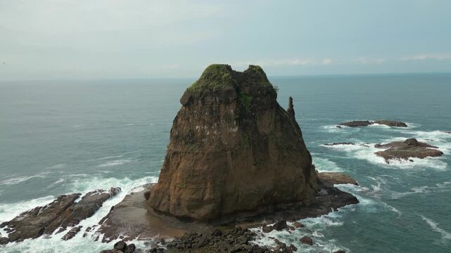 Isolated Pulau Kajang Island Surrounded By Rough Ocean Pantai Papuma Jember Indonesia Drone Track In Rise 4K 60FPS