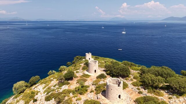 Kioni windmills - anti-clockwise drone rotate, revealing stunning Kioni harbour, Ithaca, Greek Islands