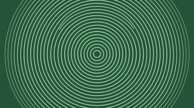Abstract concentric circle pattern on a green background with optical rings and geometric symmetry.