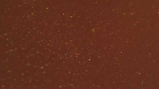 Defocused shine particles. Light glitter dot. Red orange circle stream blend glowing powder. Art color bokeh luminosity abstract background.