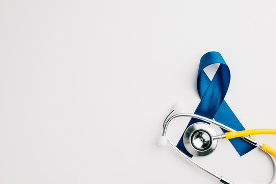 stethoscope and an awareness blue ribbon symbolize the importance of men's health