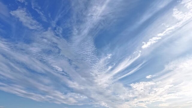 time-lapse,Bright blue sky with wispy cirrus white clouds
