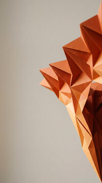 Abstract Orange Geometric Paper Sculpture Background Featuring Sharp Folds and Triangular Facets for Minimalist Design and Artistic Presentations