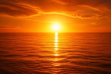 Fototapeta premium Golden sun dips low over endless ocean waves. Clouds blaze orange, reflecting on rippling water. Light traces a path across the sea's surface. Peaceful, serene, and warm - a moment of quiet beauty