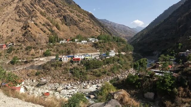Footage view of Syabrubesi village a beautiful resident village inside the Langtang National Park of Nepal. Syabrubesi lies at the base of a green hill on the way to Langtang Valley.