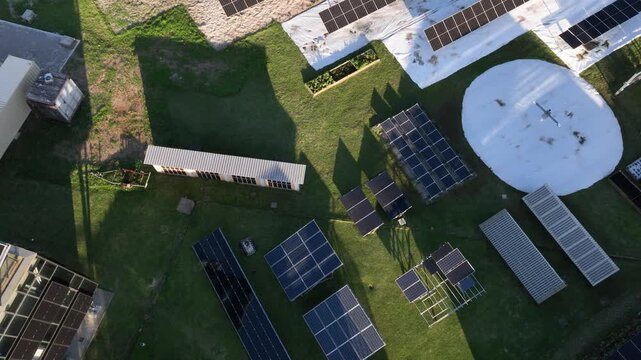 Solar Energy Technology Center with Rooftop Solar Panels, Ground-Mounted Arrays and Photovoltaic Research Systems in Florian&oacute;polis, Brazil. Aerial View.