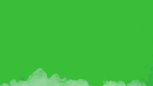 Powerful blast explosion with flying debris and smoke isolated on green screen background for chroma keying