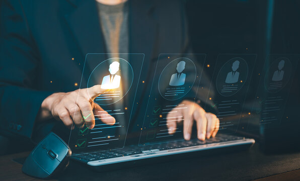 Businessman touching candidate profile hologram on screen, recruitment process, human resources management and candidate selection concept.