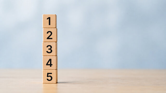 Task priority and management concept. The order of priority in any activity. Set work priority, arrange to do list. Wooden cube blocks with number first, second, third, fourth and fifth.