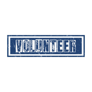 Blue rectangular rubber stamp with the word volunteer written in a bold distressed ink font style design