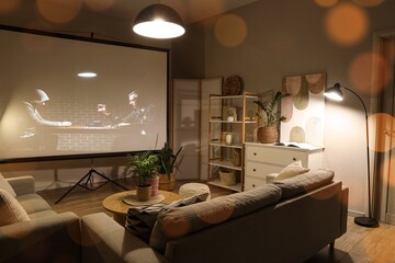 Home cinema and entertainment, people watching a movie on a projector screen in a cozy living room...