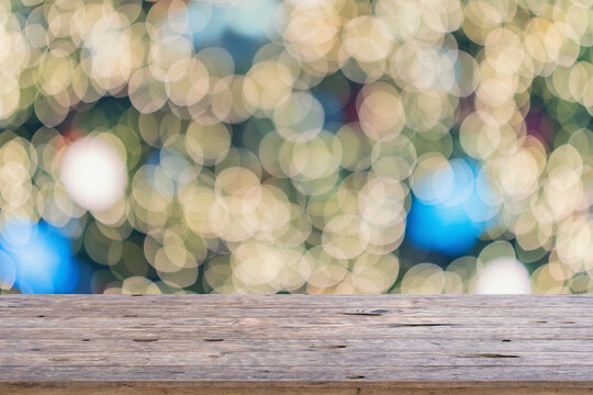 Empty wood table top with Abstract blur Christmas tree with decoration bokeh light background for product display