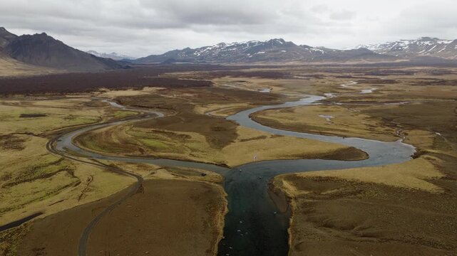 Braided Jokulsa i Loni River winds across Jokulsarsandur in Lon, Hornafjordur, East Iceland, Iceland, Europe, drone forward flyover