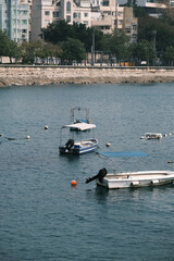 Small boats and buoys moored in Stanley Bay, Hong Kong © Steve