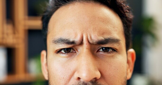 Eyes, frown and man confused in office, expression or doubt with serious reaction in business. Person, question or uncertain in portrait with body language for corporate problem solving in workplace